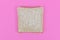 Slices of spelt wheat toast bread on pink background