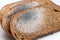 Slices of stale bread with mildew. Spoiled products_
