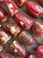 Slices of tomatoes are laid out on a baking sheet. Sprinkled with seasonings and garlic. Preparation for drying