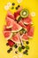 Slices of watermelon , fruits and berrieson yellow background