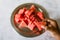 Slices of watermelon on a metal plate top view