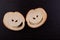 Slices of white bread with holes in the shape of eyes and a smile.