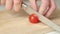 Slicing cherry tomatoes for salad