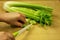 Slicing fresh celery on the old kitchen pastry board