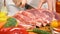 Slicing fresh raw meat for cooking in slow motion