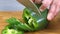 Slicing green pepper in the kitchen