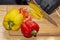 Slicing paprika cook. cooking healthy food diet healthy food. wooden cutting board on wooden table, chef hands in black rubber glo