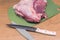 Slicing pork meat on piece. Cooking meat dishes.