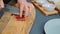 Slicing smoked sausages on a cutting board