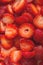 Slicing strawberries. Preparing berries for freezing. Close up texture and background of red ripe, freshly picked strawberries