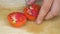 Slicing tomato on cutting board