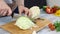 Slicing white cabbage on the tray