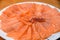 Slided Raw Salmon in white dish on wood blackground