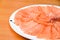 Slided Raw Salmon in white dish on wood blackground