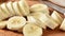 Slider shot of a sliced banana on a cutting board