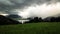 Slider time-lapse of austrian mountains, lake and stormy clouds moving