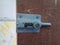 sliding door lock in rustic wooden door