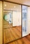 Sliding-door mirror wardrobe in modern hall interior