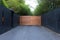 Sliding driveway door with iron and wooden panel