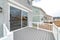 Sliding glass door at the deck of home with scenic view of the neighborhood