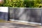 Sliding portal grey aluminum and wooden door home gate of suburbs house in city