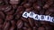 Sliding through Roasted coffee beans with word ARABICA written in little white cubes. Arabica, Robusta