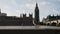 Sliding shot of Big Ben and houses of Parliament during conservation refurbishment from other side of Thames river, Walking seagul