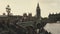 Sliding shot of Big Ben and houses of Parliament during conservation refurbishment, people and traffic on Westminster Bridge