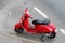 Sliema, Malta, July 2014. Beautiful red scooter in vintage style on a city street.