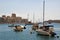 Sliema, Malta, July 2014. Parking for yachts and boats on the background of modern buildings of the city.