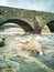 Sligachan Old stone Bridge over River Sligachan with Beinn Dearg Mhor and Marsco peak of Red Cuillin mountains in