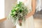 Slightly disheveled fresh and airy bridal bouquet with a grinn ball, brunia, eringum, eustoma, asparagus and eucalyptus in the