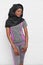 Slim african model in black hijab and grey sportswear.