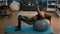 Slim athletic woman with dark skin working body muscle doing morning fitness exercices