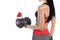 Slim, bodybuilder girl, lifts heavy dumbbell while training in the gym.