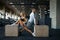 Slim couple doing exercise on cubes in gym