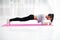 Slim fit girl doing planking core muscles exercise