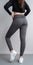 Slim fit girl in yoga pants. Photo from back.