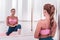 Slim and fit woman with tattoo on her ribs enjoying amazing yoga time