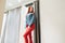 Slim girl with redheads chooses clothes. woman in red leather pants posing in fitting room bottom view