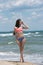 Slim girl wear bikini, beach with wild waves