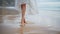 Slim legs walk sand shore closeup. Romantic girl stepping ocean shore in dress