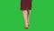 Slim legs of woman wearing high heel shoes walking on a Green Screen, Chroma Key.