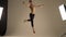 Slim man balerun topless shows movement Grand Jete, slow motion