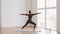 Slim Sporty African American Woman Practicing Yoga, Making Warrior 2 Pose
