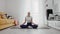 Slim sporty african american woman practicing yoga on a mat. Woman warms up before training