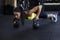 Slim sporty woman doing push-ups exercises on kettlebells. Cross fit training