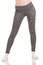 Slim woman legs move apart to shoulders in grey patterned thermal pants in white socks