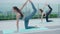 Slim woman practicing yoga on the balcony of her condo. Asian woman doing exercises in morning. balance, meditation, relaxation,