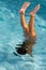 Slim young woman diving into a pool